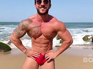 Nudist beach aficionado James Santos leads a wild, muscle-worship session, flaunting his sculpted physique. Watch as he flexes, poses, and earns a steamy, muscular cumshot tribute.